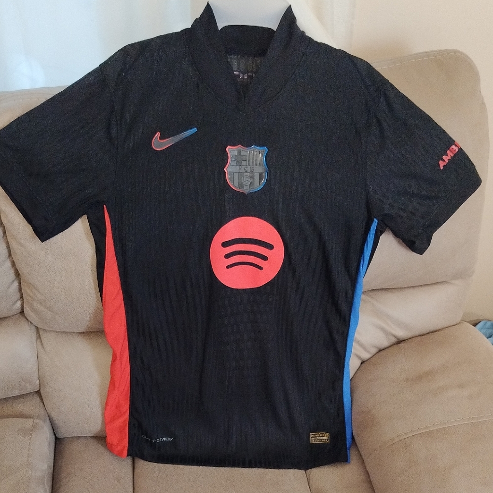 Nike Kids Black Soccer Jersey with Red and Blue Accents